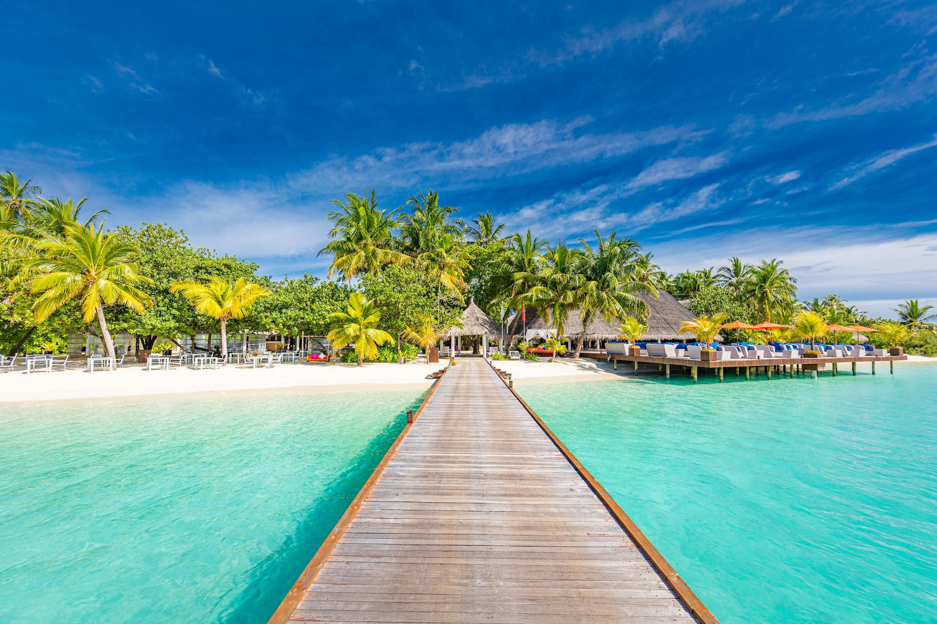 Hotel marketing of beautiful luxury resort in Maldives with beach view from wooden pier