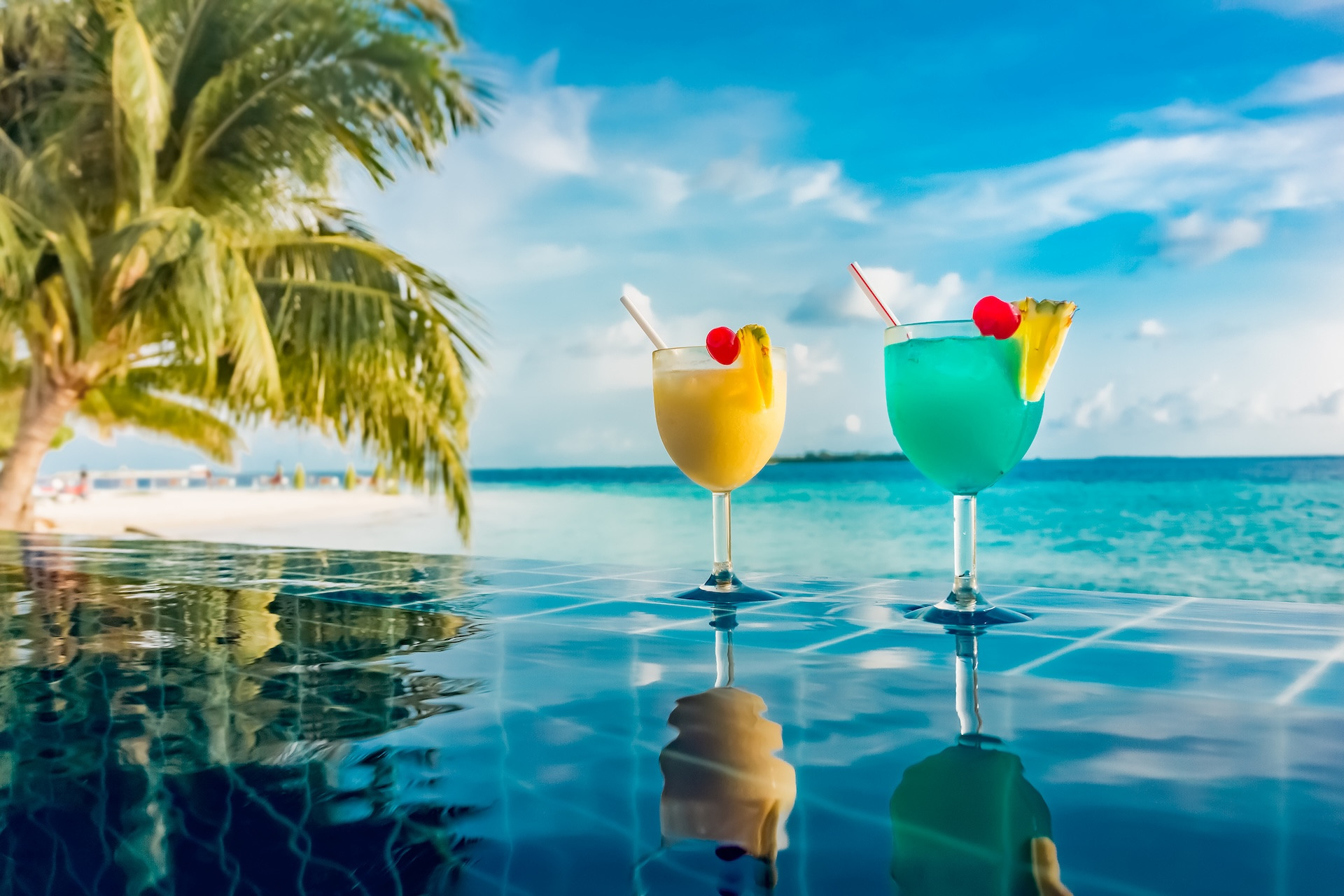 Hotel marketing of luxury Maldives resort with cocktail near the pool